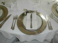 Table setting with silver underplate 